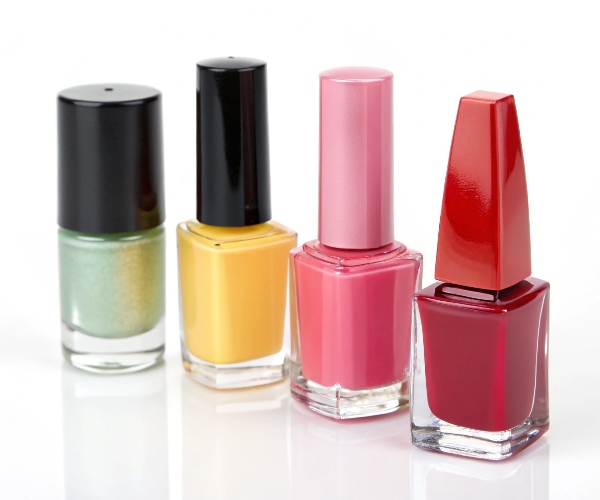 A collection of different types of nail polish bottle shapes, including round, square, and cylindrical, for custom manufacturing