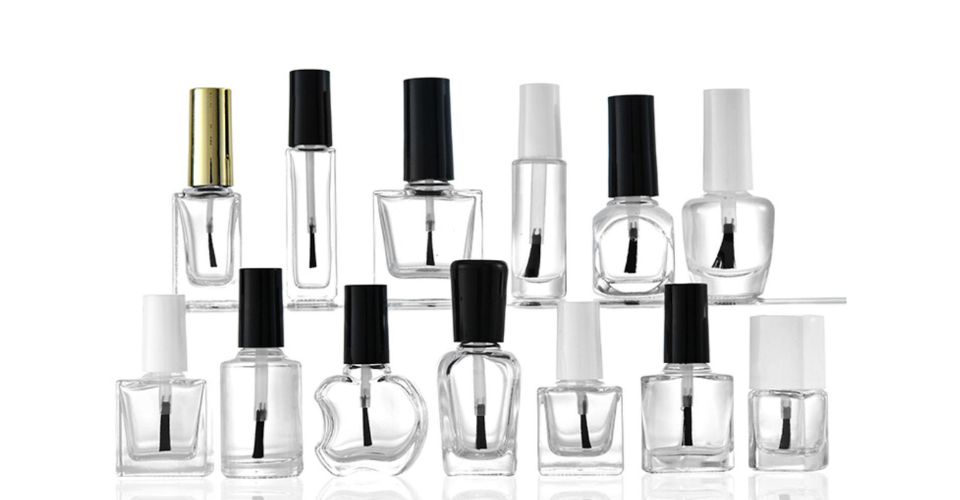 A visual comparison of three nail polish bottles side-by-side: a large professional size, a standard 15 ml size, and a small mini size.