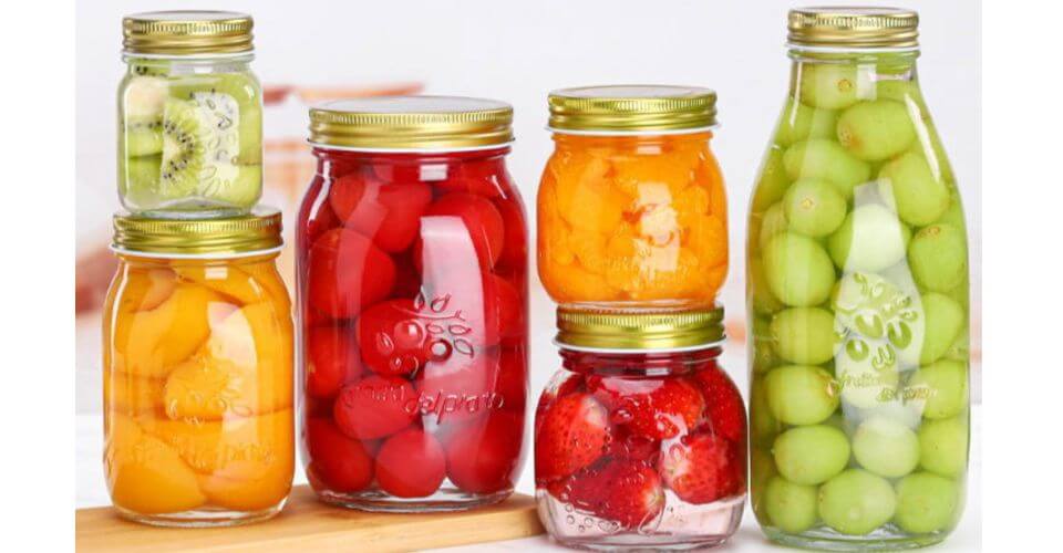 A variety of Mason jars with lids in different sizes.
