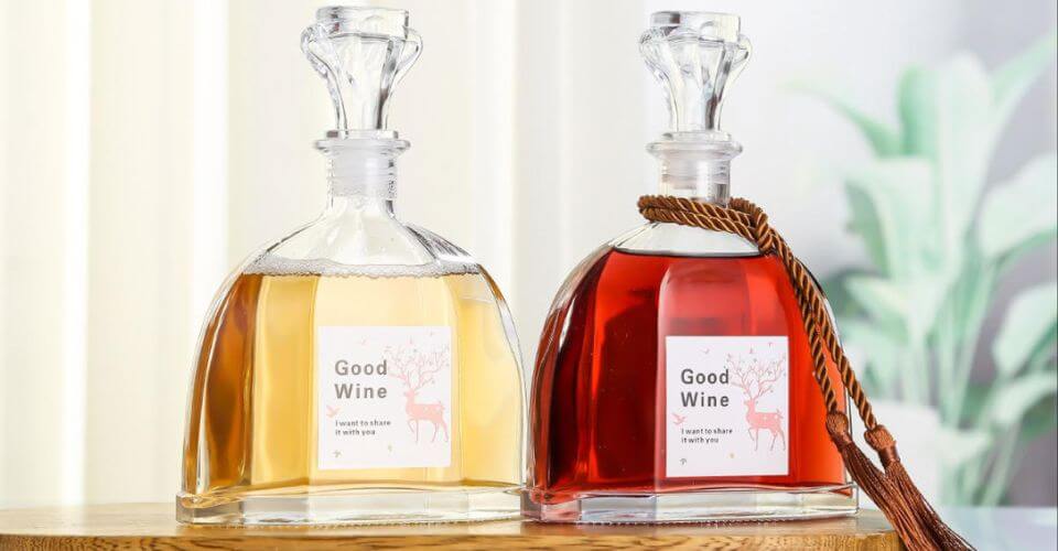 Examples of different surface treatments on liquor bottles, including a frosted bottle, a color-sprayed bottle, and one with a detailed decal.