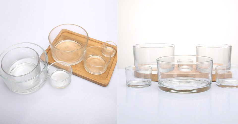 A clear 14 ounce candle jar with different size round glass candle jar on the table